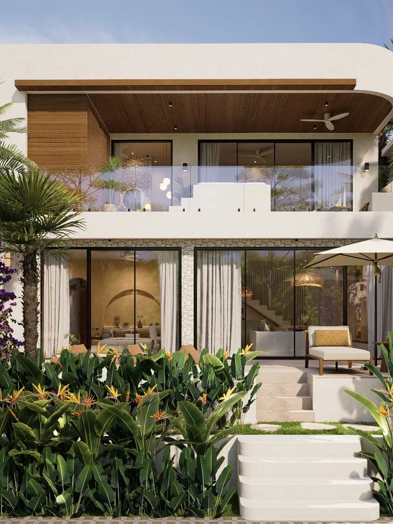 The two-bedroom villa's full exterior framed by palm trees and bougainvillea