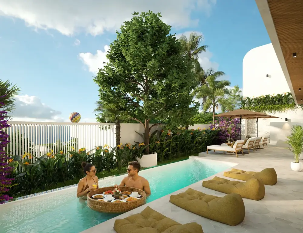 Guests enjoying a floating breakfast in the private pool of a LIMEANA villa